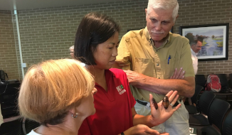 Dr. Jody Green shows Madagascar Hissing Cockroaches at an extension event.