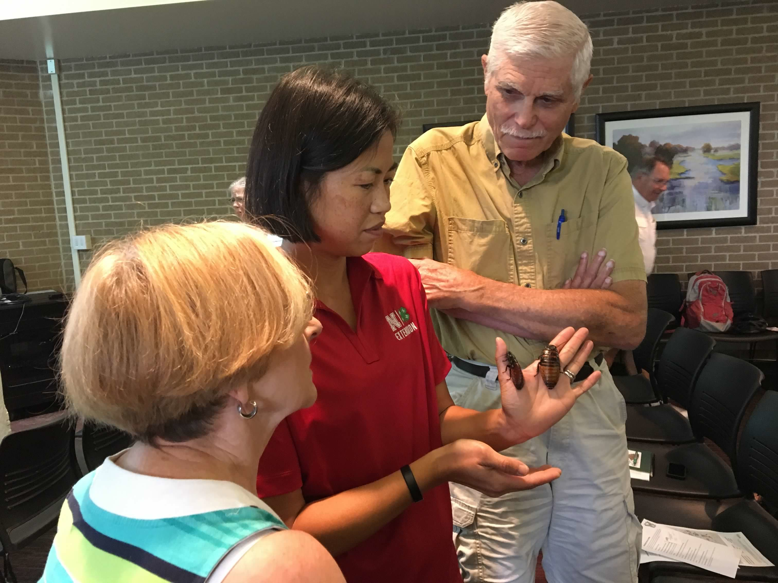 Jody Green displays Madagascar Hissing Cockroaches during an Extension event. 