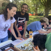 Andrea Rilakovic and Sanket Shindle answer insect questions at the EC Discovery Days and Farmer's Market