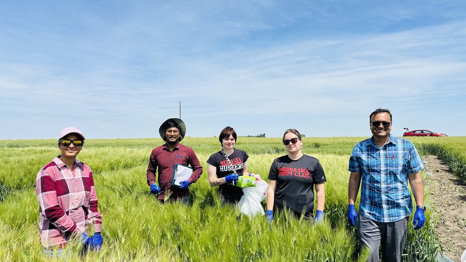 Dr. Shaonpius and his students in the field